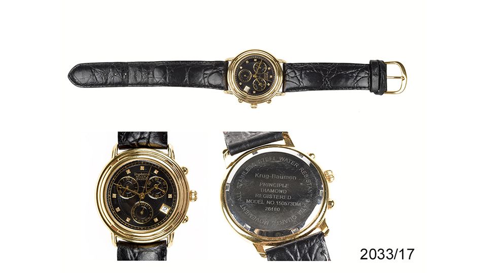 goldene Armbanduhr mit schwarzem Lederarmband Krug-Bäumen